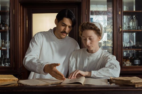 Two Pharmacists Reading a Book