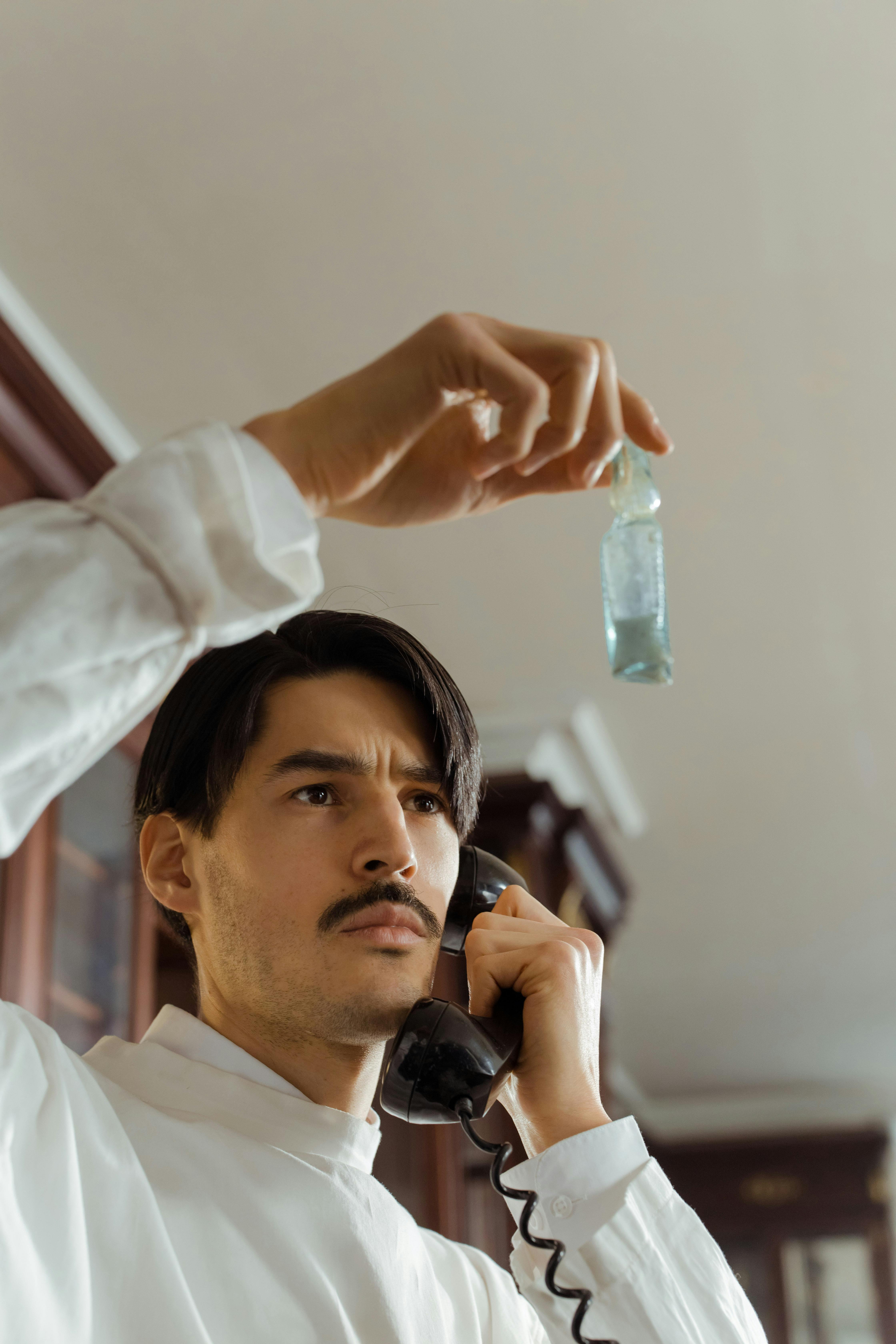 Vintage-styled chemist in a lab coat examines a flask while using a rotary phone, capturing a retro scientific ambiance.