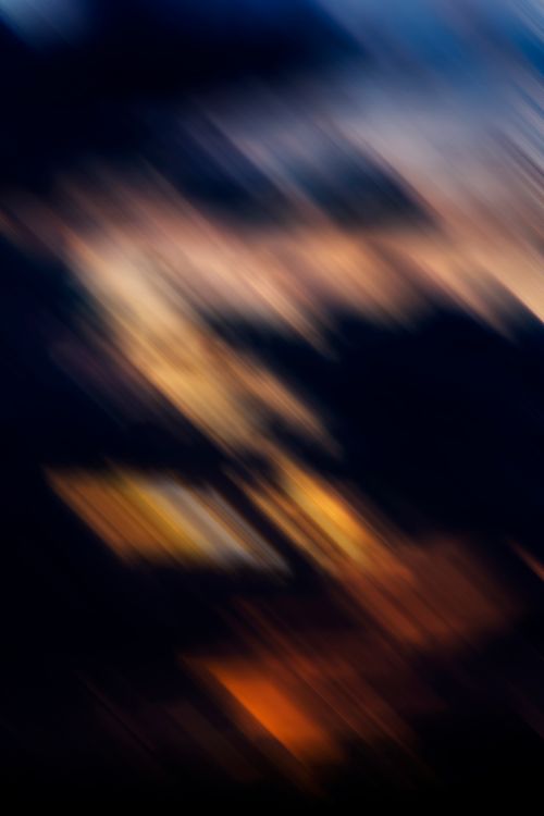 Free Blurred abstract art showcasing warm, vibrant light trails in a dynamic composition. Stock Photo