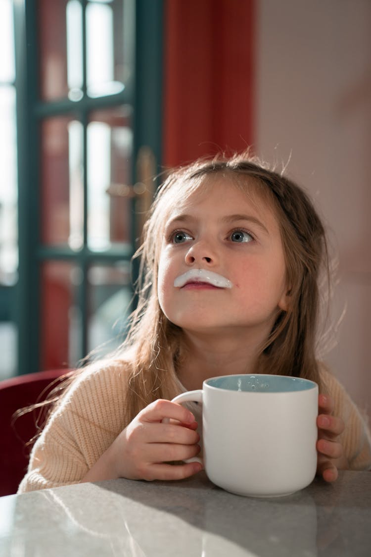 A Girl Holding A Mug