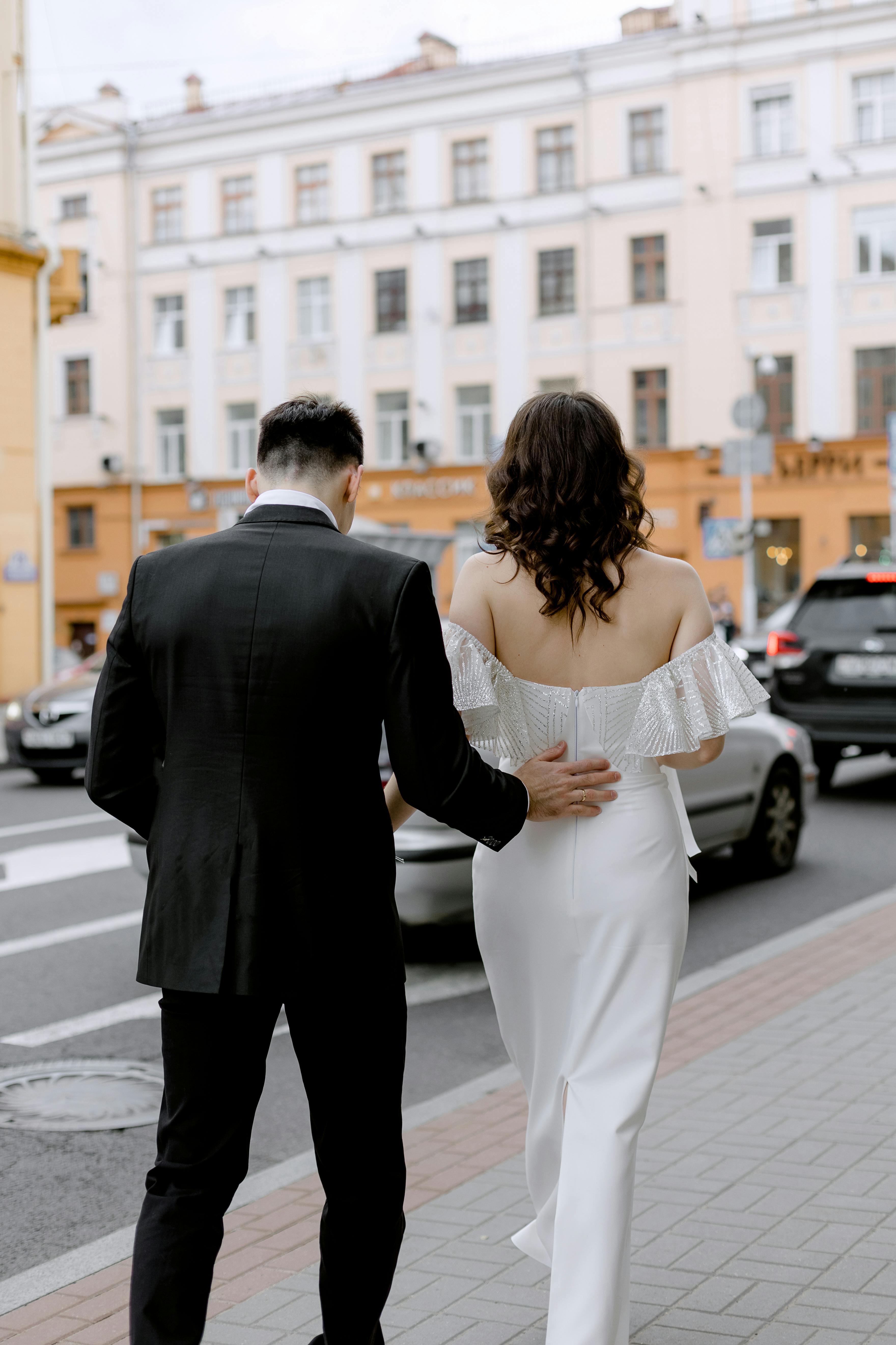 Man and Woman in Formal Attires Walking on Sidewalk · Free Stock Photo