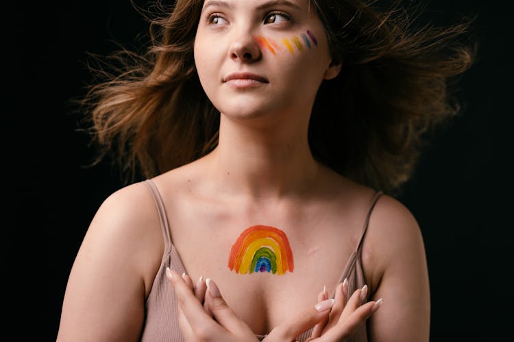 Woman With Rainbow Painting On Her Chest