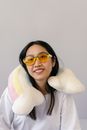 Woman in White Fur Coat Wearing Blue Framed Sunglasses