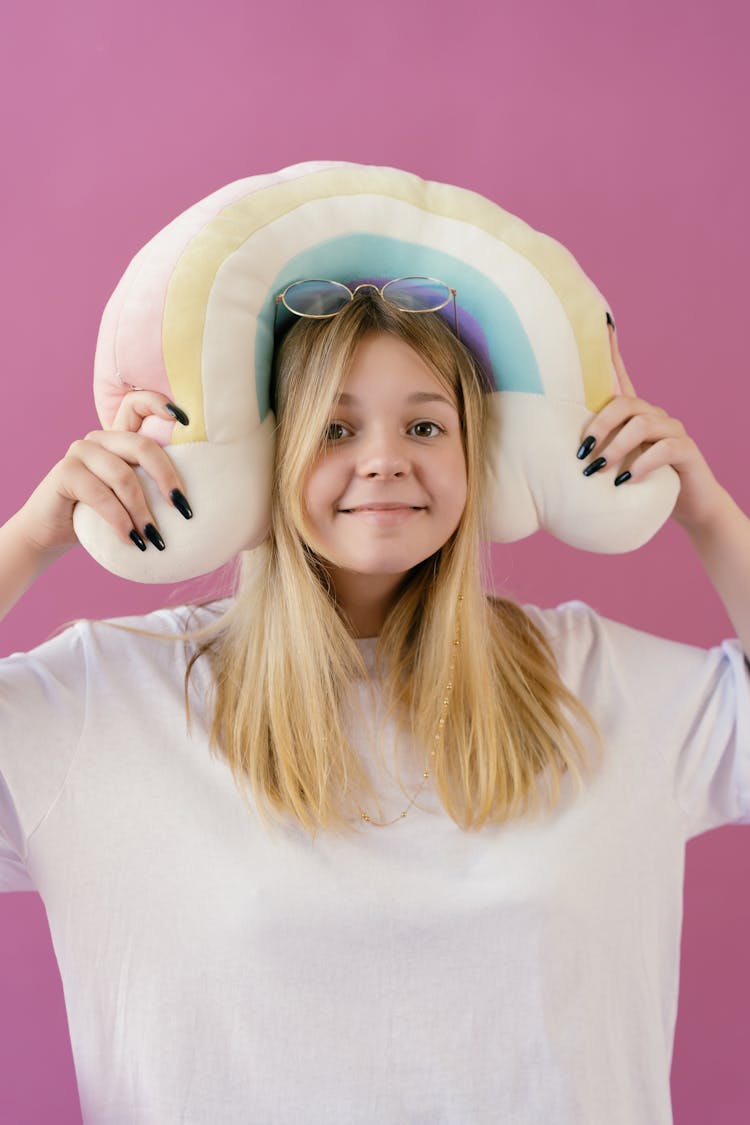 Girl In White Crew Neck Shirt Holding A Stuff Toy