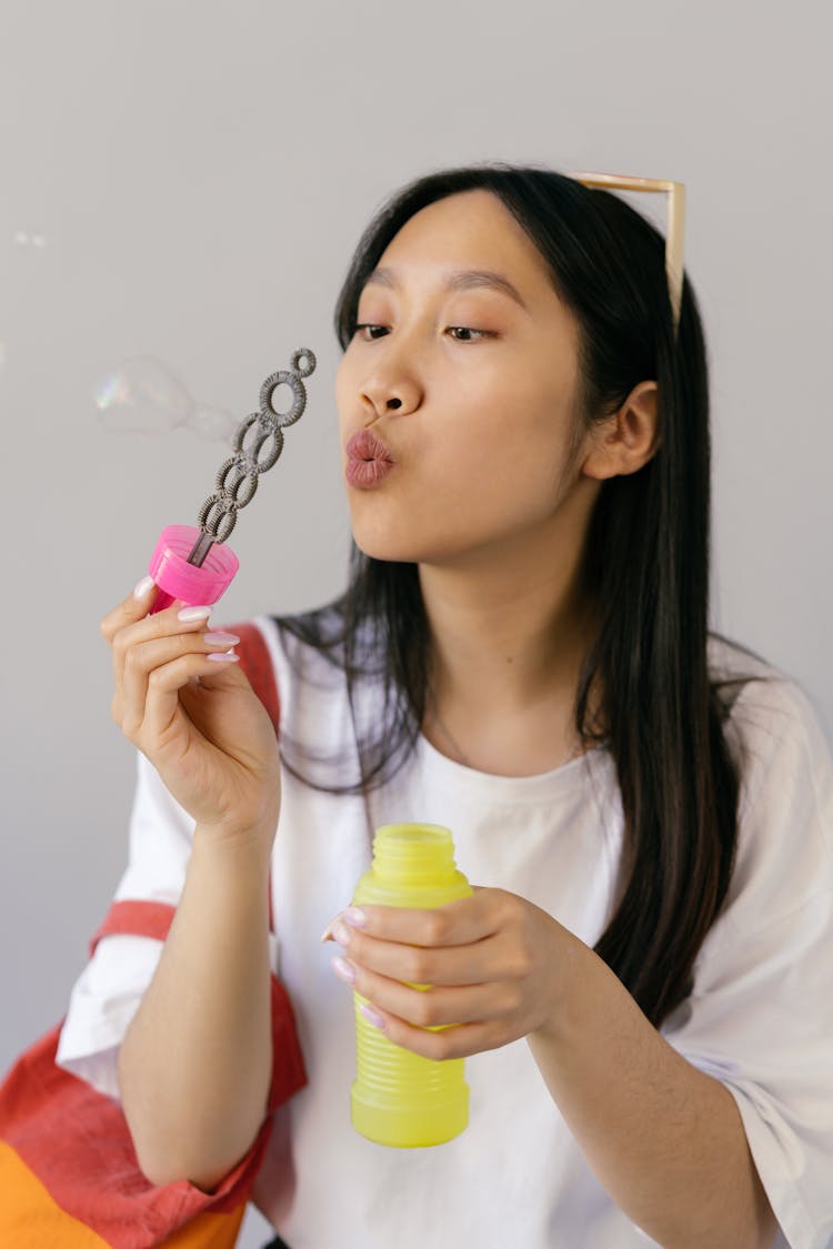 Woman Playing With Bubble Toy