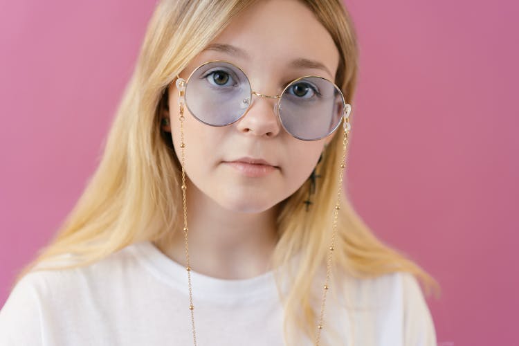 A Girl With Blond Hair Wearing Sunglasses