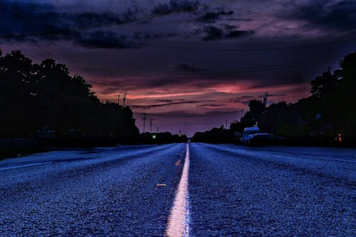 Free stock photo of paved road, storm, sunset