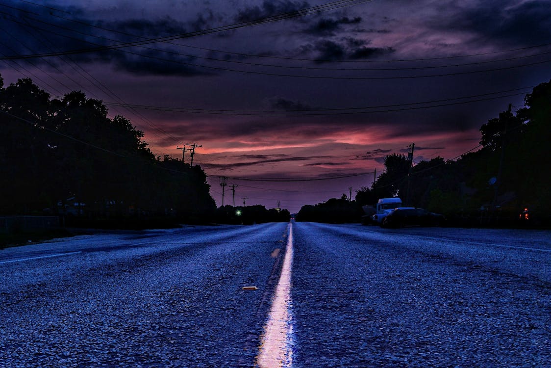 Free stock photo of paved road, storm, sunset Stock Photo