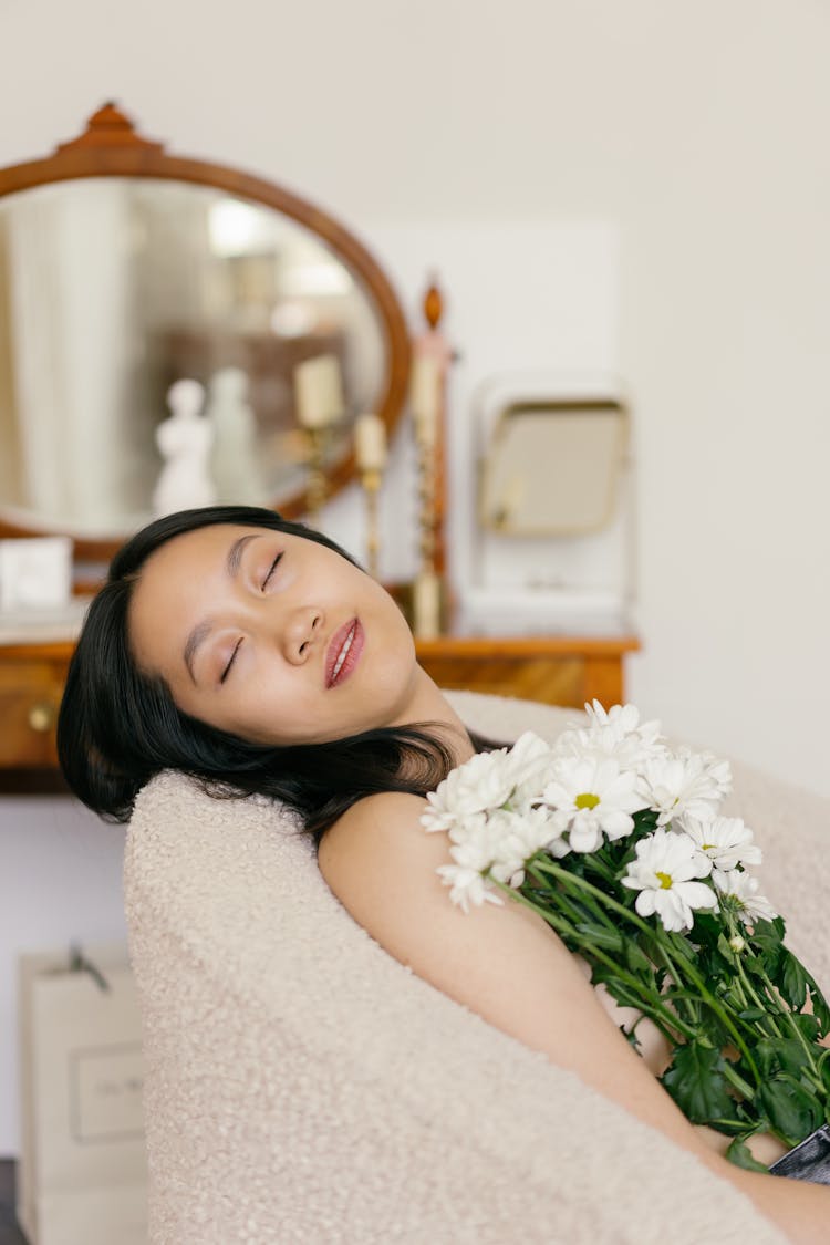 A Casual Woman Holding A White Bouquet