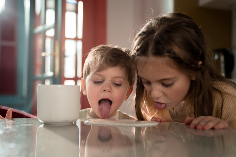 Kids Licking The Table