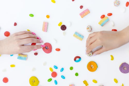 Photograph of Hands Getting Candies