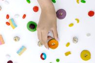 A Person Holding a Round Chewy Candy