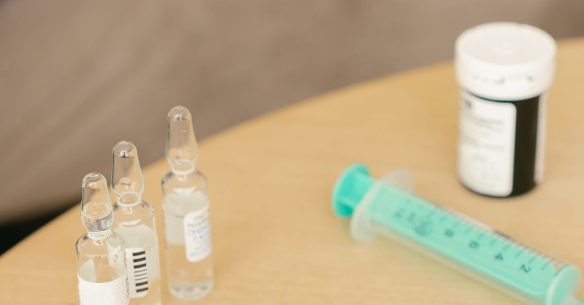 A lancet pen beside ampoules