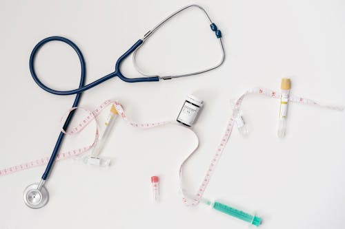 White and Blue Stethoscope on White Surface