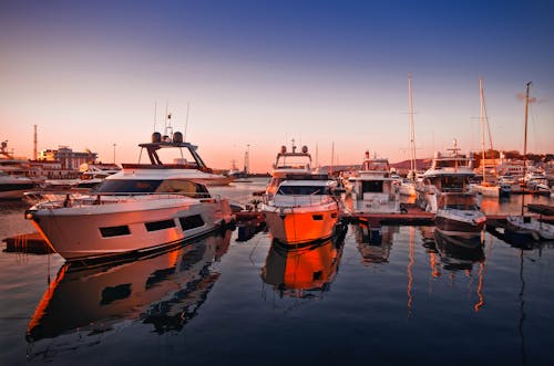 Free Yachts Docked on the Harbour during Sunset Stock Photo