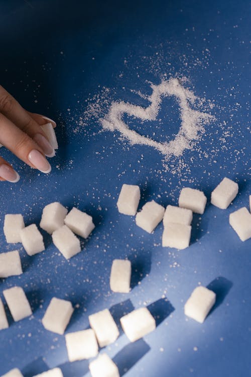 Free White Sugar Cubes on Blue Textile Stock Photo