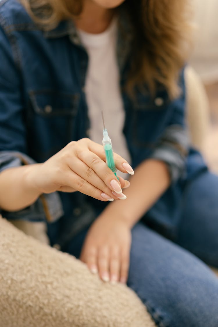 Woman Holding A Syringe