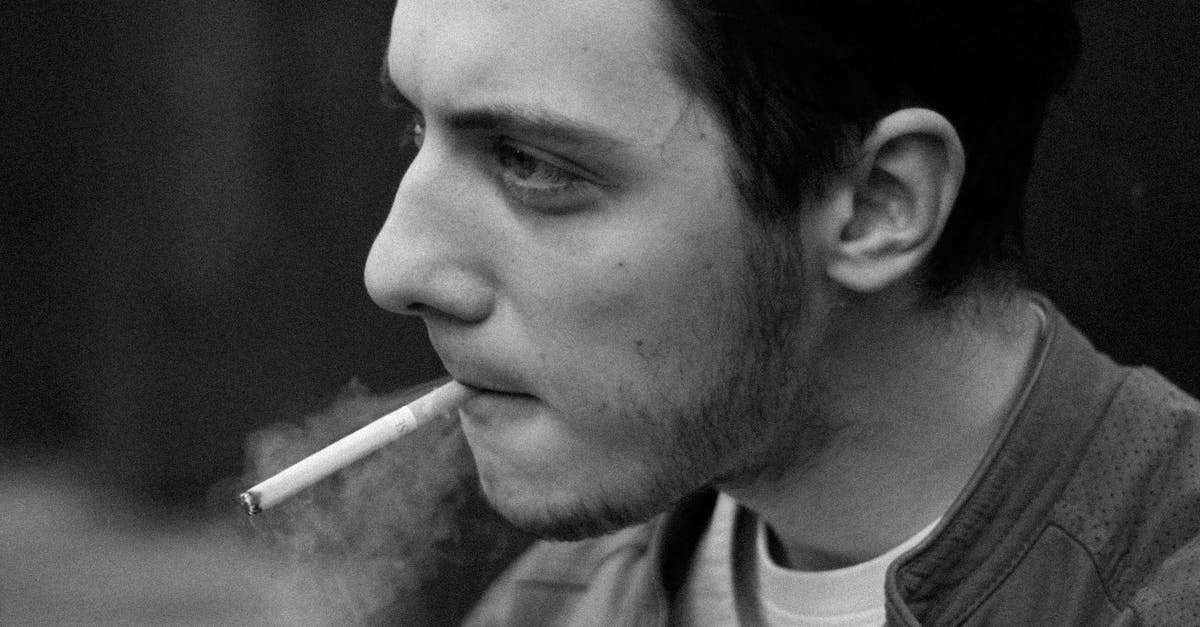 A Man Smoking a Cigarette · Free Stock Photo