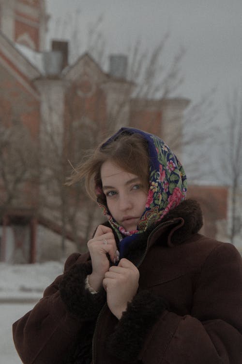 Woman Wearing Brown Jacket and Headscarf