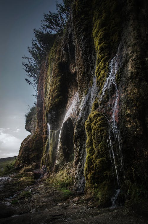 Falling Water from the Rocks in the Mountains