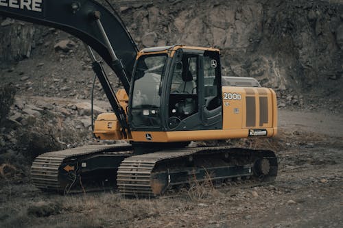 Yellow Backhoe with Gear-Driven Track 