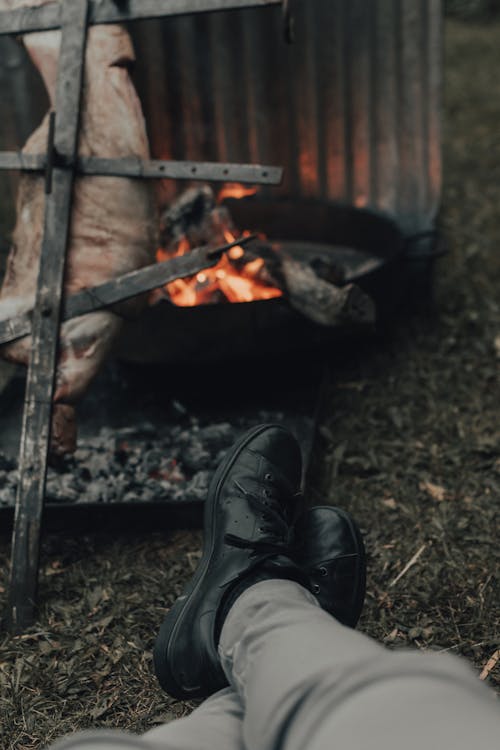 Free Person with Black Shoes Enjoying the Heat Stock Photo