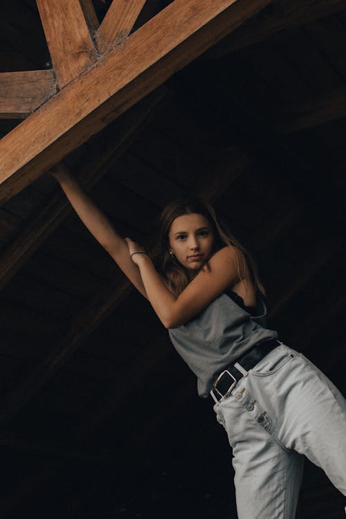 Free Woman Holding a Wooden Beam Stock Photo