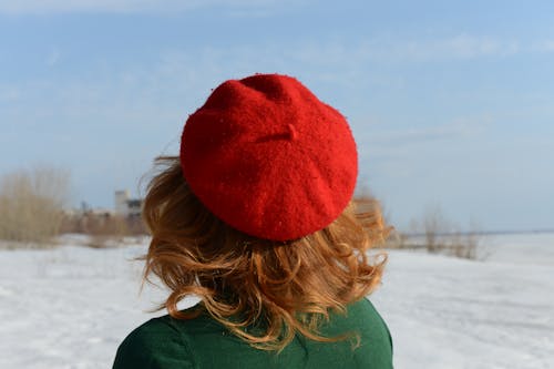 Back View of a Woman Wearing Red Knit Cap