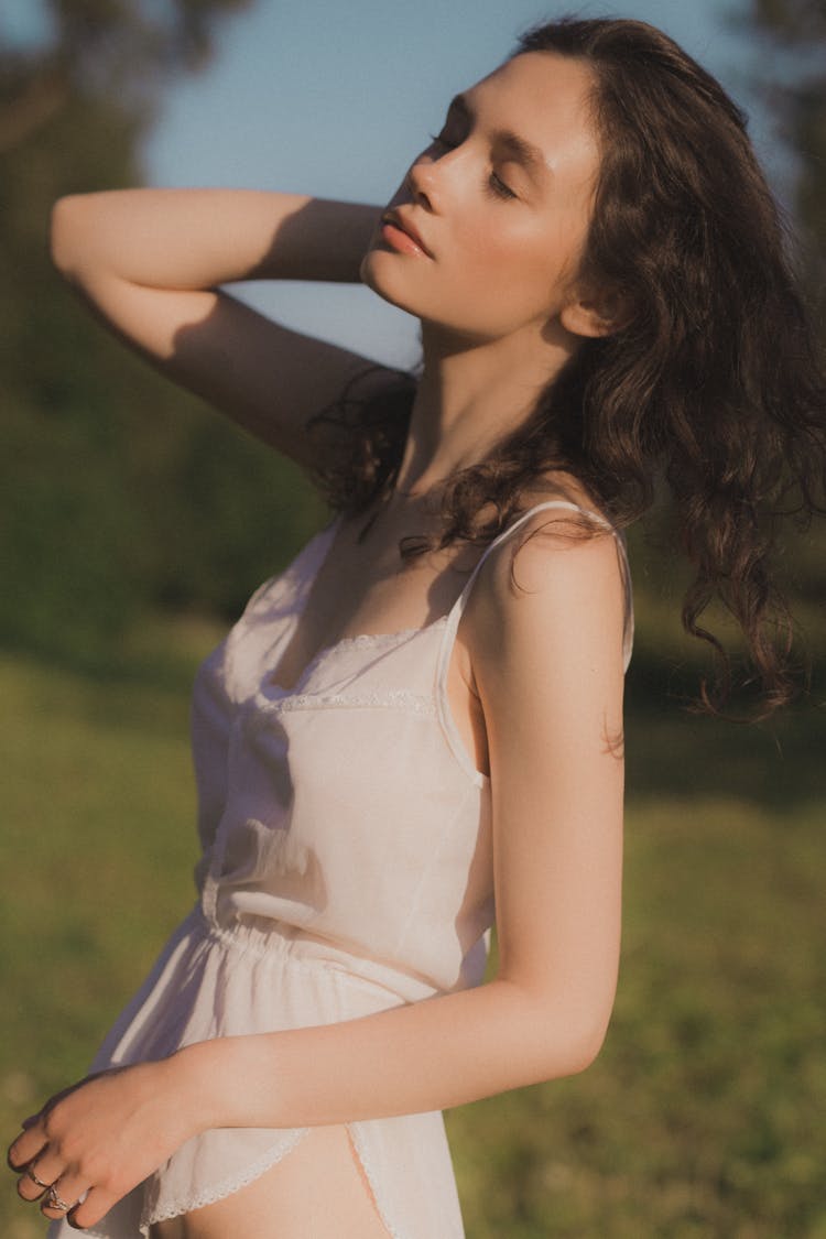 Fine-Looking Woman In White Sleeveless Dress