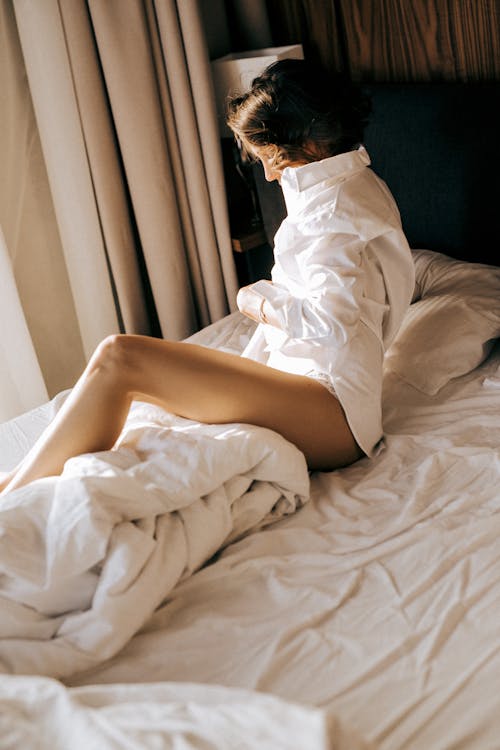 Sexy Woman Wearing White Long Sleeves while in Bed