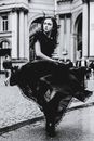 Fierce Woman Twisting her Black Dress