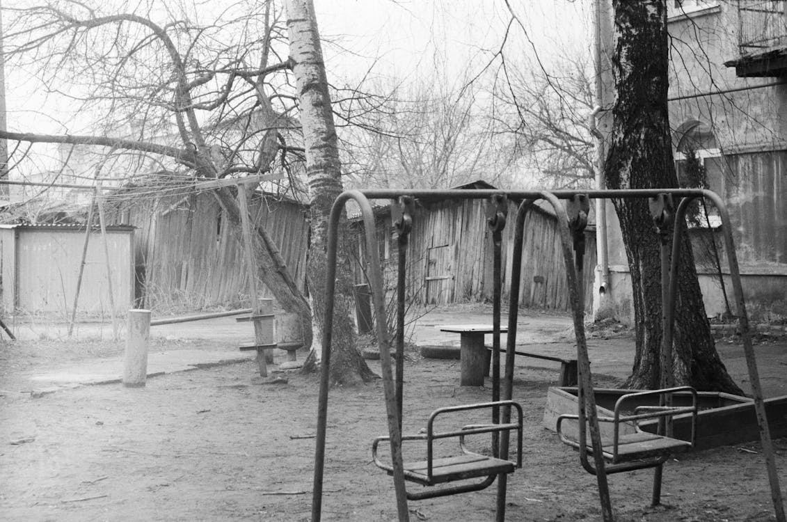 Black and White Photo of Swings