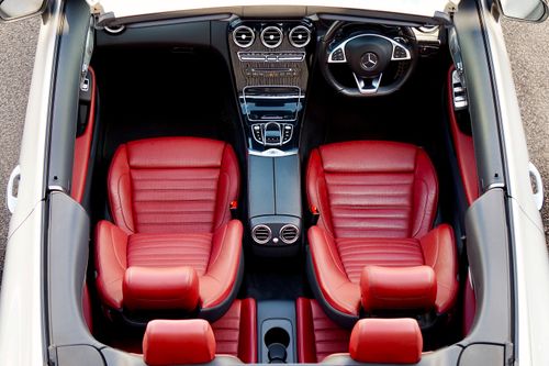 Free Top-down view of a luxury convertible with red leather seats and sleek dashboard controls. Stock Photo