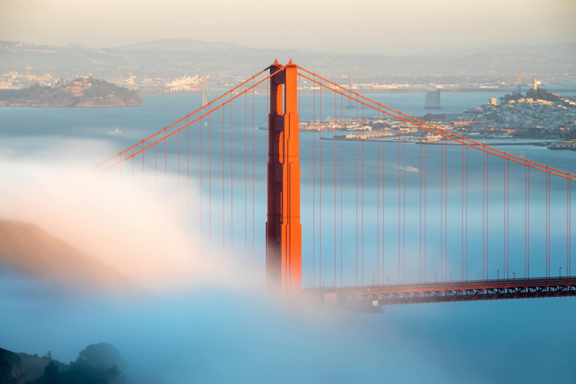 A stunning view of the Golden Gate Bridge as fog rolls in, creating a mystical ambiance.