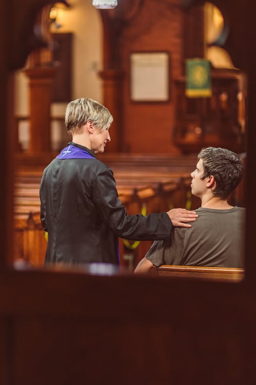 Middle Aged Woman Comforting Man 