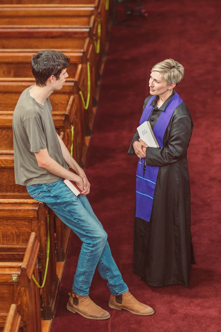 Man Talking To A Clergy 