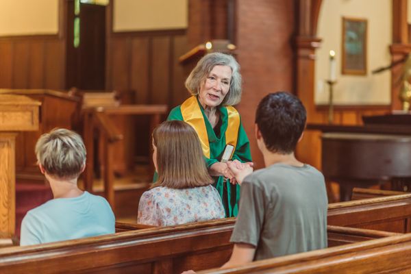 A church member warmly welcoming a visitor