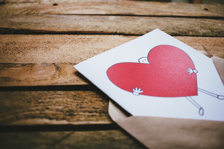 Man Holding Red Heart Poster