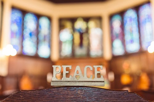 Free "Peace" Word Carved in Wood Stock Photo