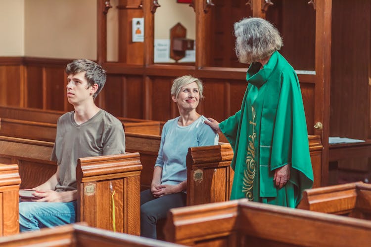 Clergy Looking At A Woman 