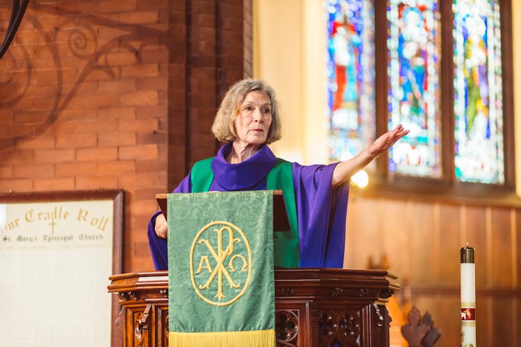 Female Priest On A Pulpit 