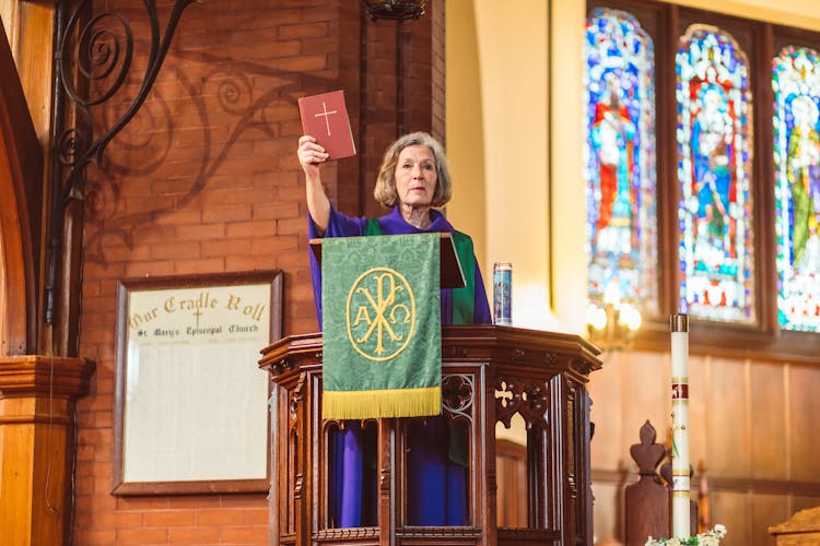 Female Priest On A Pulpit 