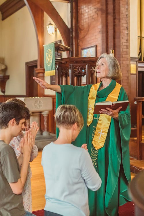 Free A Woman Priest Preaching Stock Photo