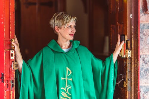 Free Female Priest on the Doorway Stock Photo