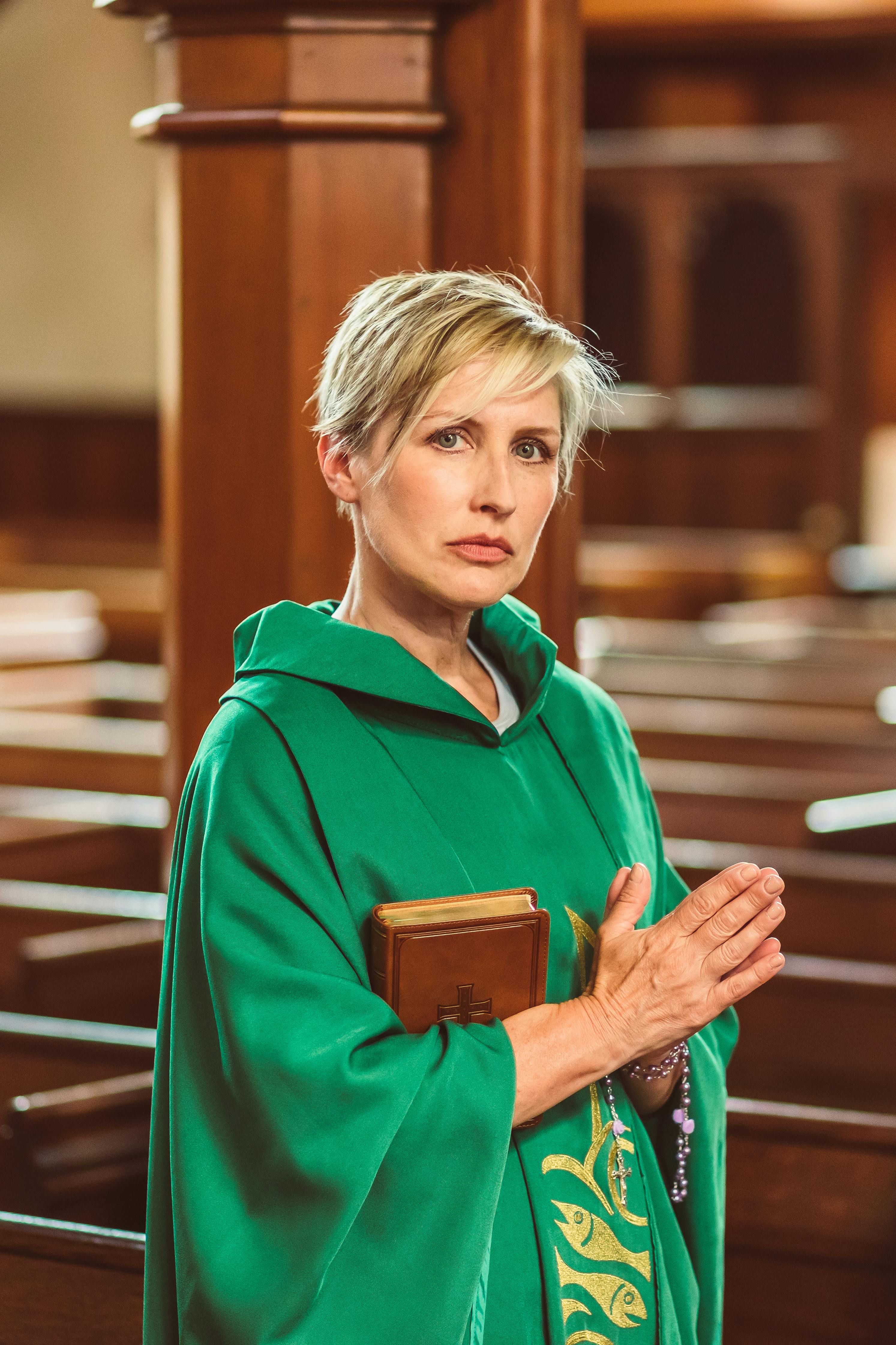 female priest inside a church