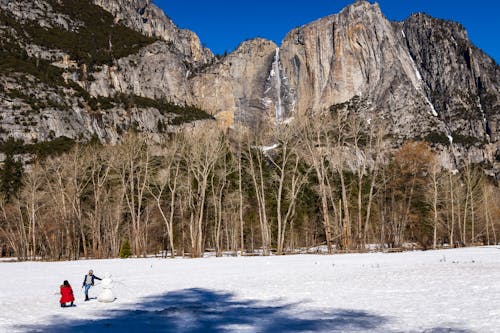 People in the Snow near the Rocky Mountains