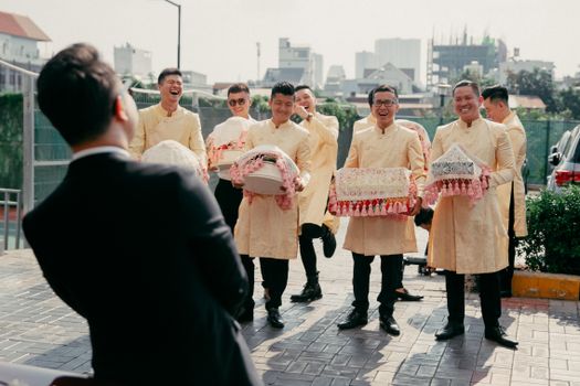 Groomsman carrying Presents 