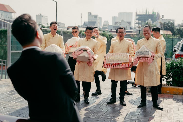 Groomsman Carrying Presents 