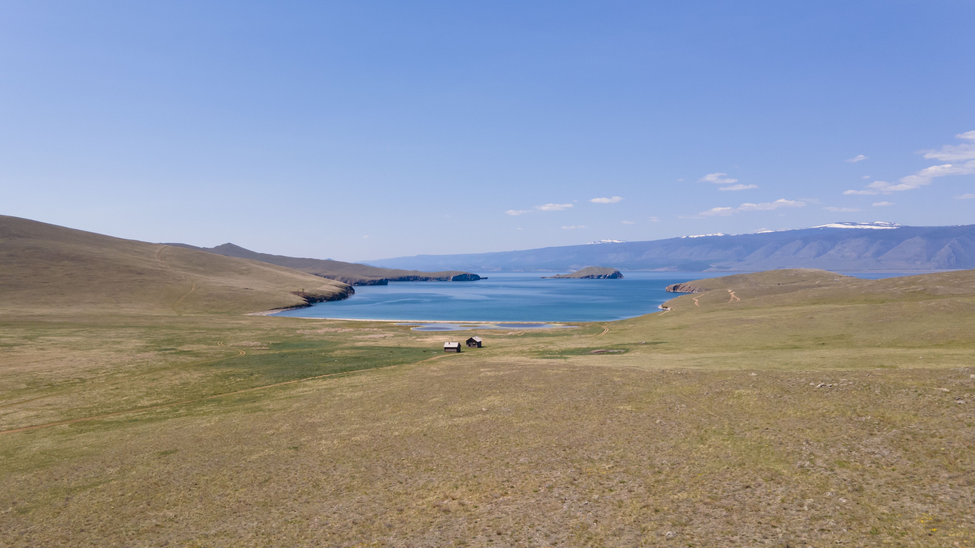 A breathtaking view of Olkhon Island on Lake Baikal, surrounded by serene landscapes.