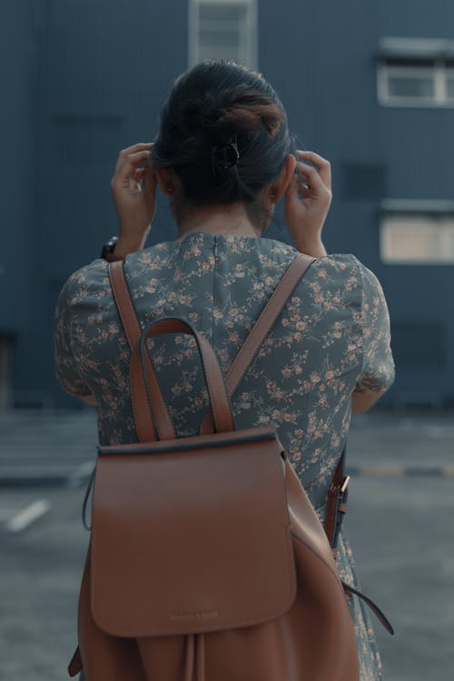 Free Back View of a Woman Wearing a Leather Backpack Stock Photo